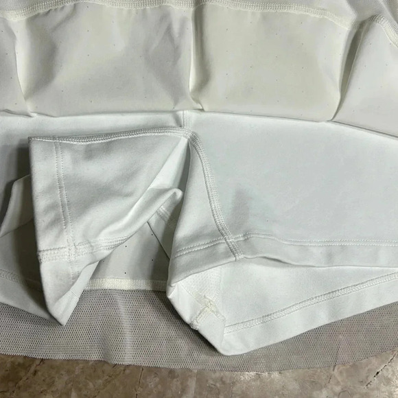 New Balance white skort with lace hem , pin holes in skirt and cut out in band - Picture 12 of 13